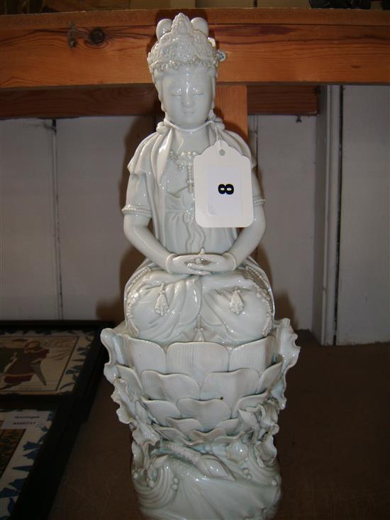 Chinese blanc de chine figure of Guanyin seated on a lotus flower, H 14ins